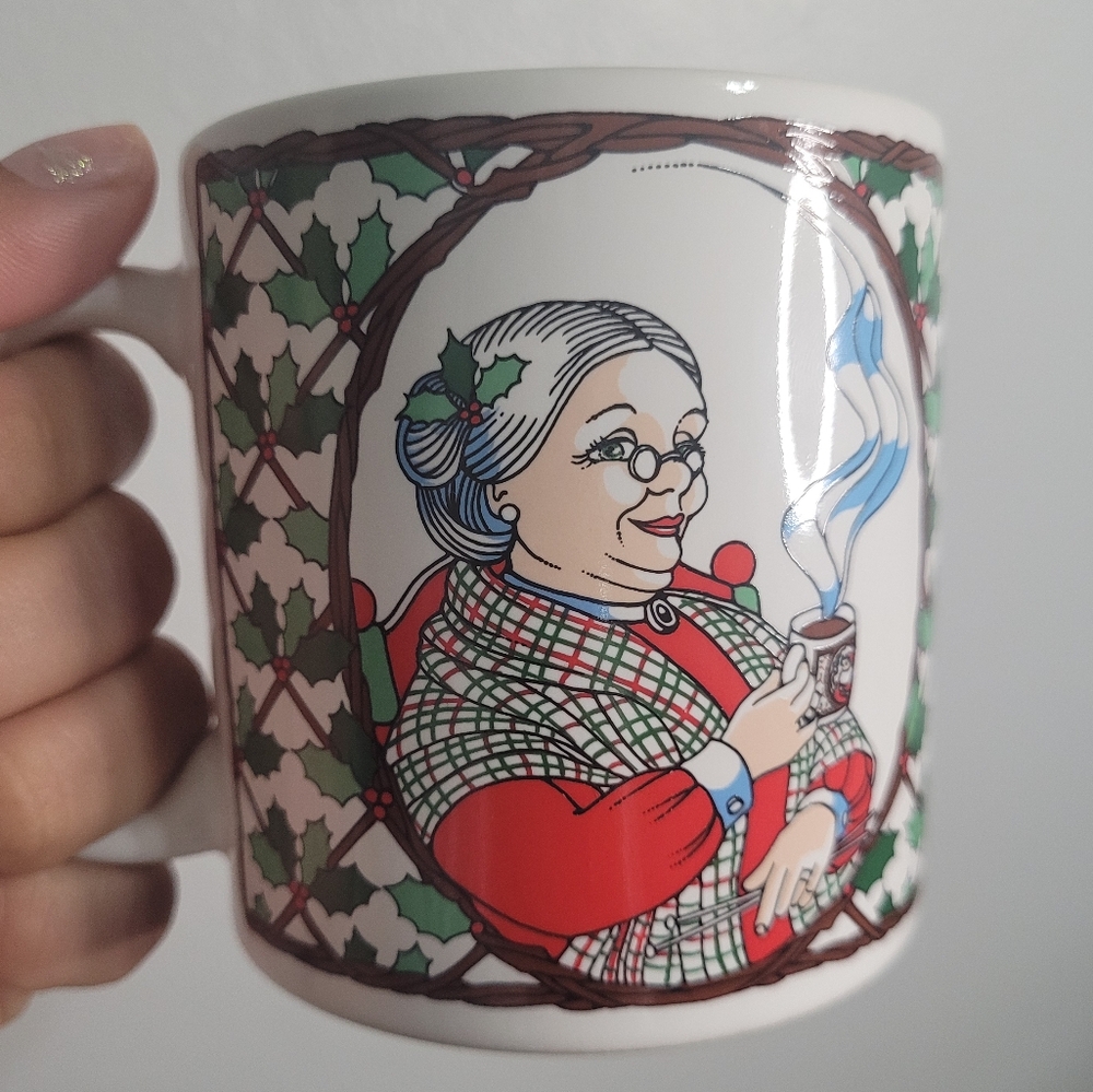 Ceramic mug with a Christmas design. Mrs. Claus and Santa Claus. Coffee or tea.